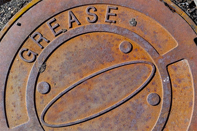 rusty grease trap cover